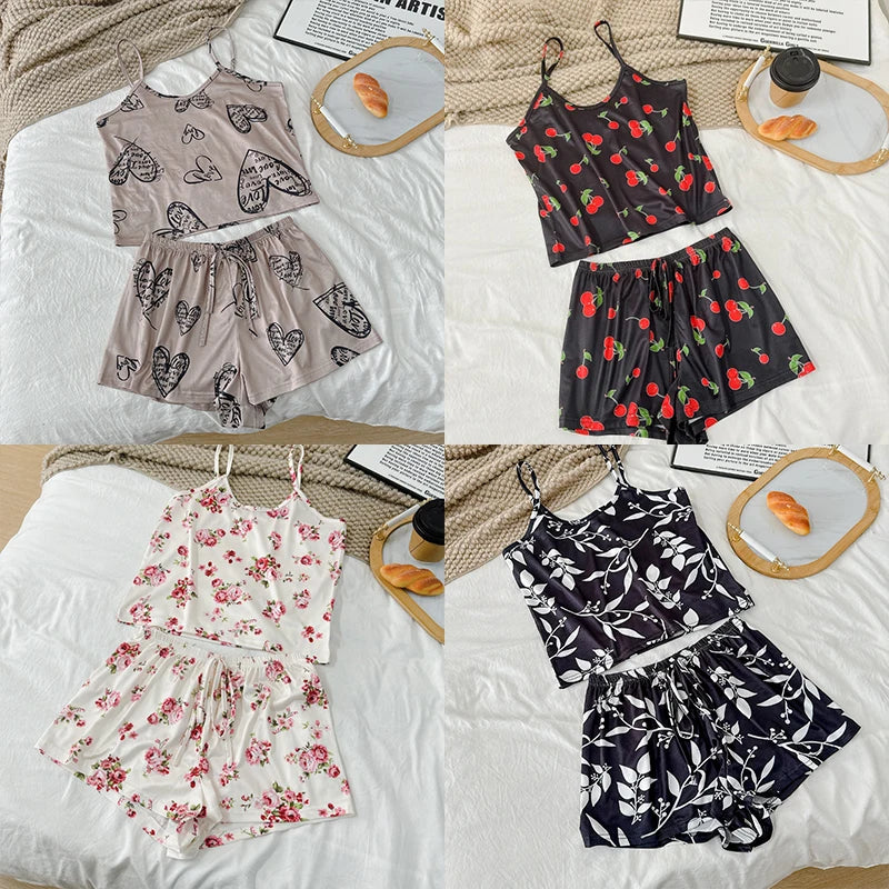 Four different outfits laid out on a bed with a neutral background.