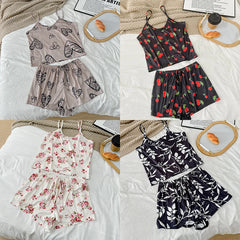 Four different outfits laid out on a bed with a neutral background.