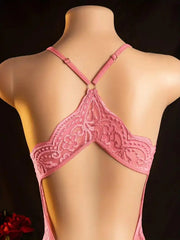 Pink lace bra on a mannequin against a dark background