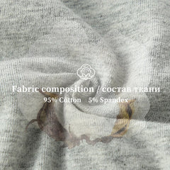 Close-up of gray fabric with a floral pattern, featuring fabric composition text overlay.