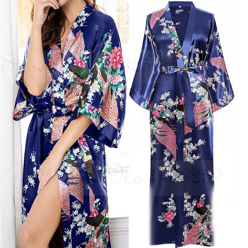 Navy blue satin robe with floral and peacock print on a white background