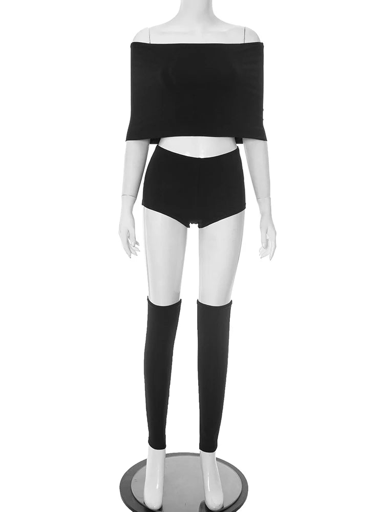 Mannequin wearing a black off-shoulder top and shorts on a white background