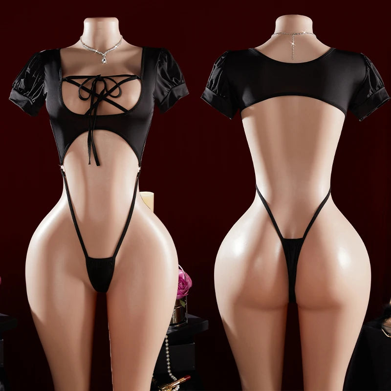 Black lingerie set on mannequins against a dark background