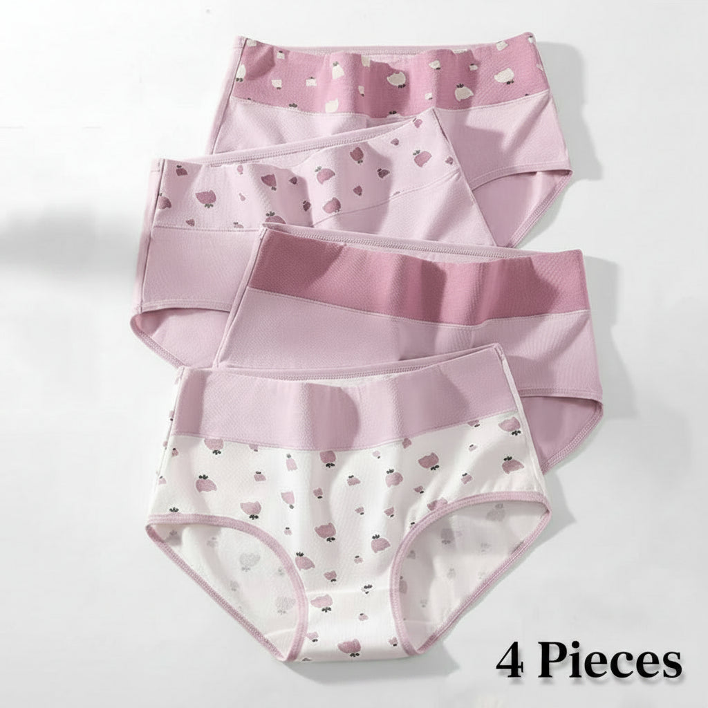 Set of three pairs of pink and white underwear with heart patterns on a light gray background