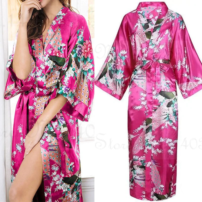 Pink floral satin robe with a model wearing it, displayed against a neutral background.