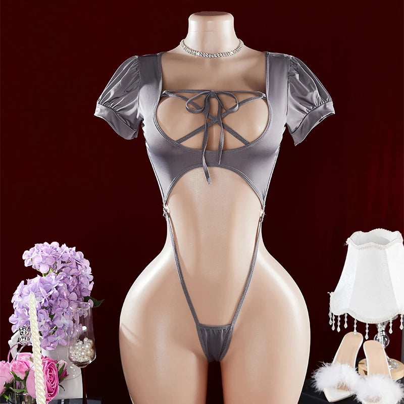 Mannequin wearing a gray lace-up bodysuit with a dark background