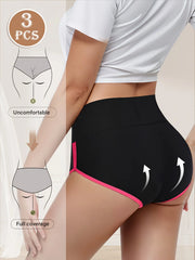Black athletic shorts with pink trim worn by a person, with a diagram showing coverage levels.