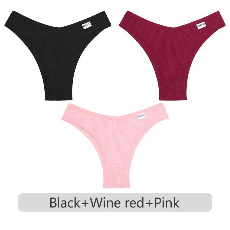 Three pairs of underwear in black, wine red, and pink on a white background.