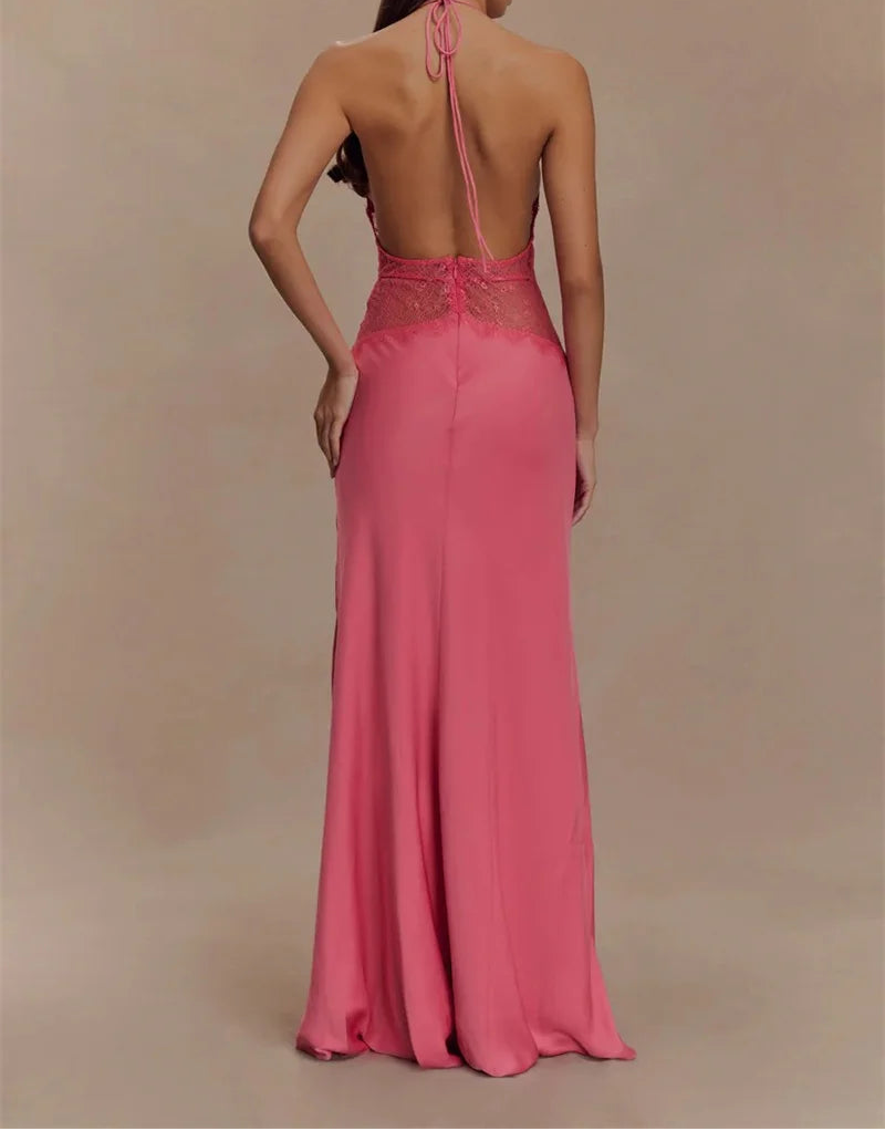 Woman wearing a pink evening gown with a backless design on a beige background
