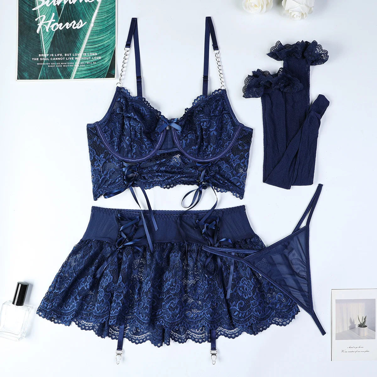 Navy blue lace lingerie set on a white background