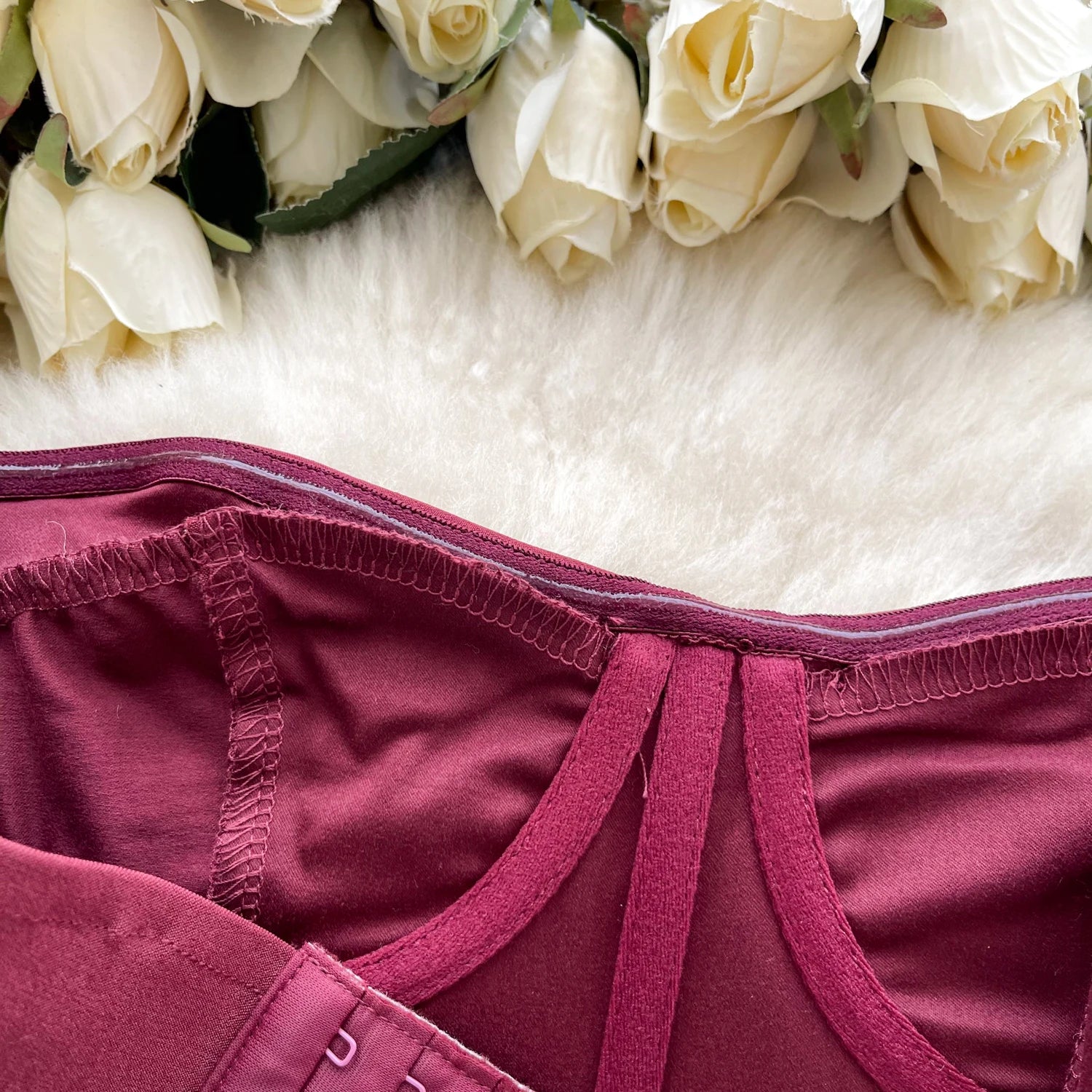 Maroon underwear with white roses on a white background