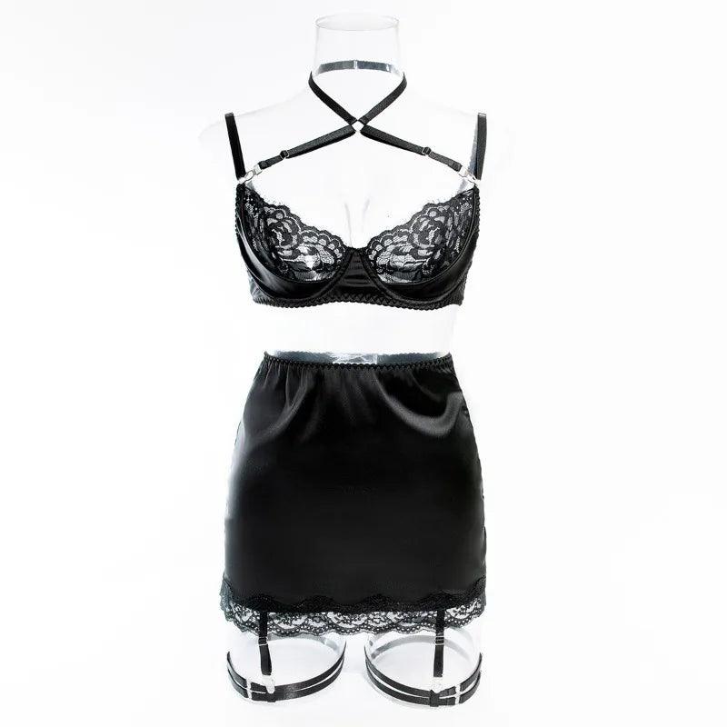 Black lace lingerie set on a mannequin against a white background