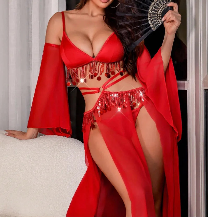 Woman in a red outfit with fringe details holding a black fan.