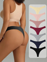 Woman wearing a beige sports bra and black underwear with a color swatch of various underwear options on a gray background.