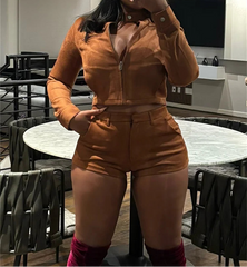 Person wearing a brown leather outfit in a modern indoor setting