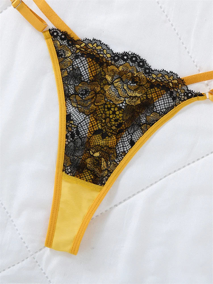 Close-up of the black lace bodice and yellow straps on the chemise.