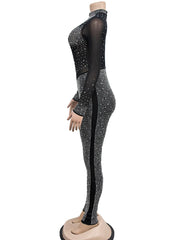 Black and silver bodysuit with rhinestone detailing on a mannequin against a white background