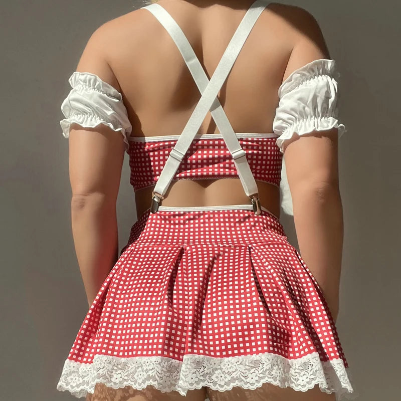 Red and white checkered dress with suspenders on a plain background