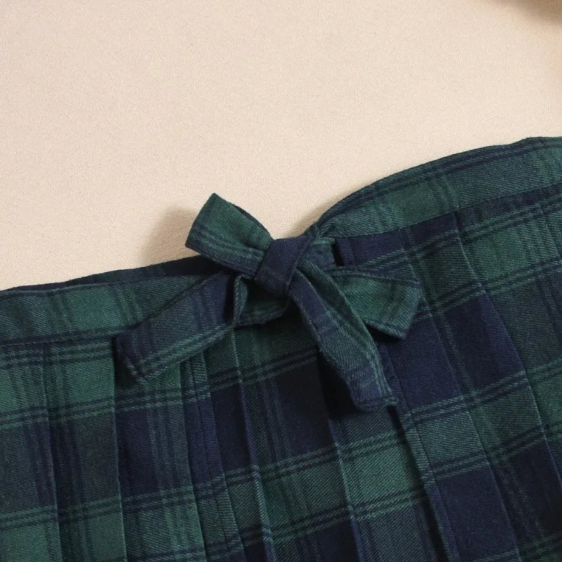 Green plaid fabric with a tie detail on a beige background