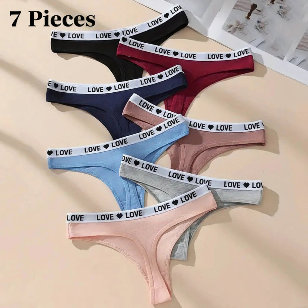 Set of women's underwear with 'LOVE' waistbands in various colors on a beige background.
