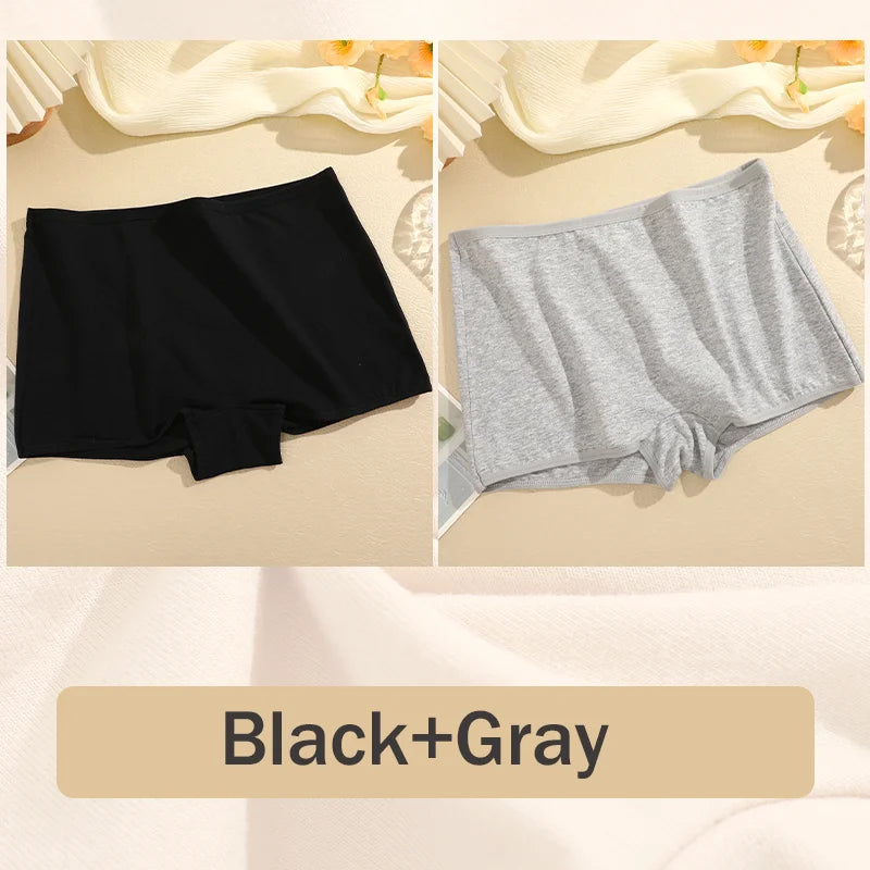Black and gray boxer briefs on a beige surface with 'Black+Gray' text.