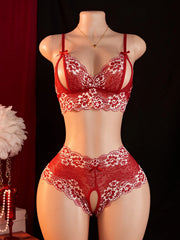 Red lace lingerie set on a mannequin against a dark background