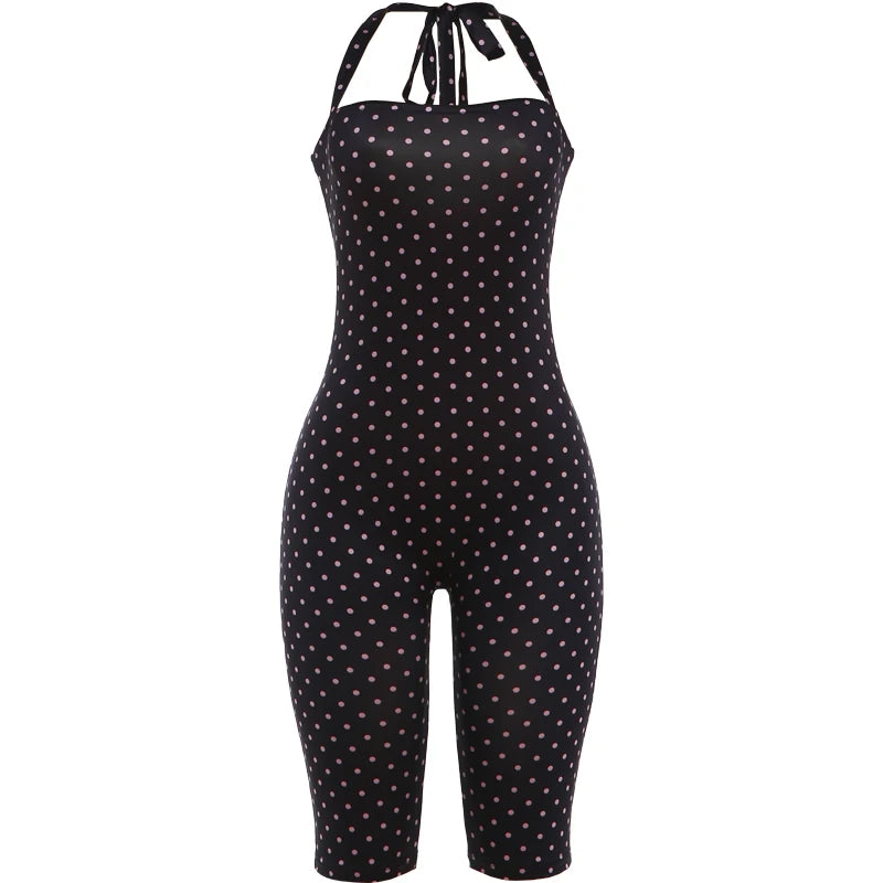 Black polka dot jumpsuit on a white background