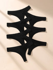 7 black thong-style underwear on a beige fabric background