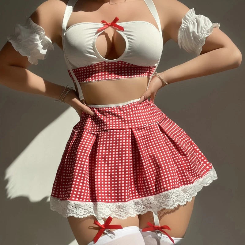 Red and white polka dot outfit with a white apron and gloves on a neutral background