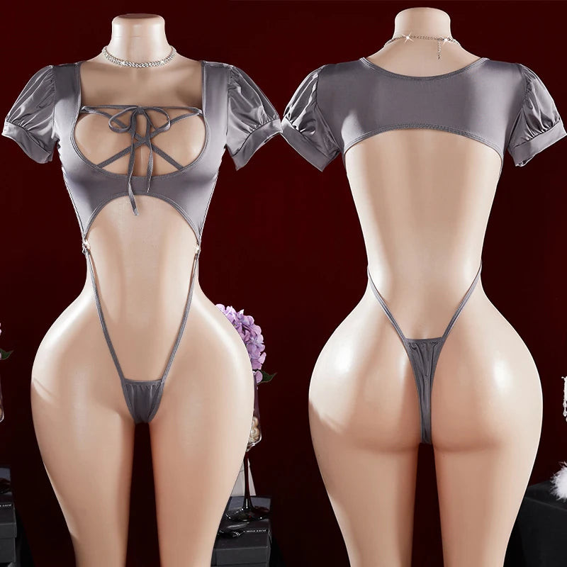 Gray lace-up bodysuit on mannequins against a dark background