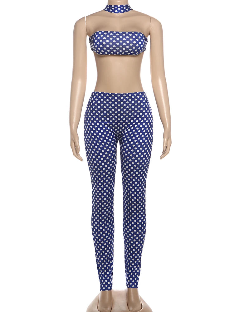 Mannequin wearing a blue and white polka dot bikini set on a white background