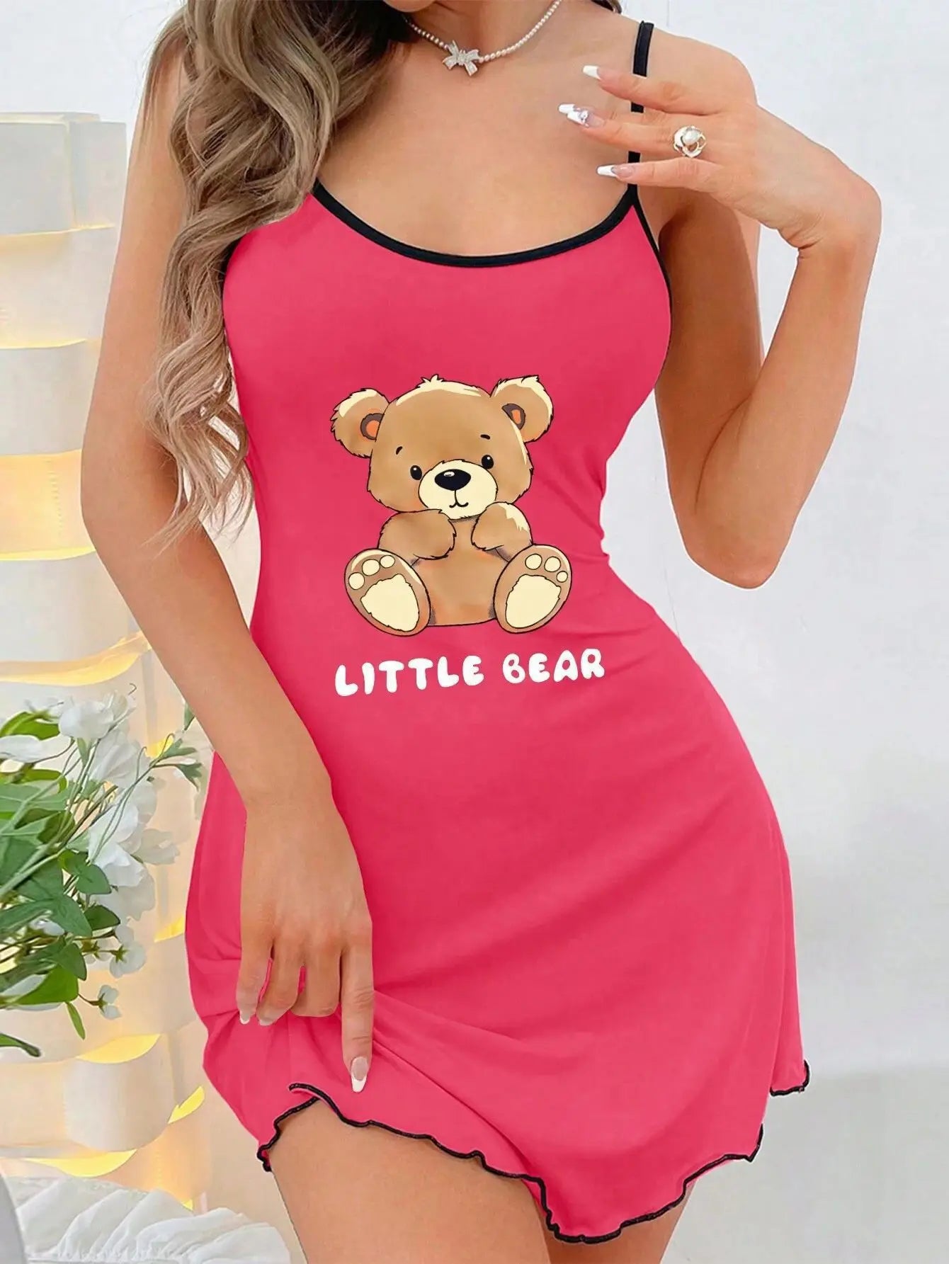 Pink nightgown with teddy bear design and 'Little Bear' text on a white background