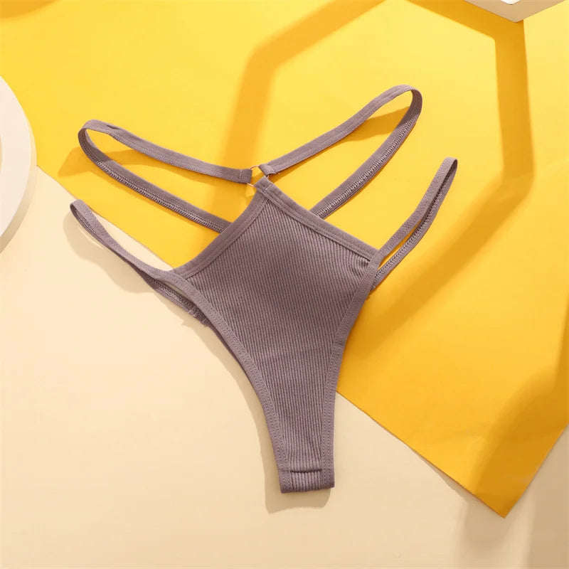 Gray bikini bottom on a yellow and beige geometric background