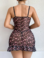 Woman wearing a floral patterned nightgown against a white background