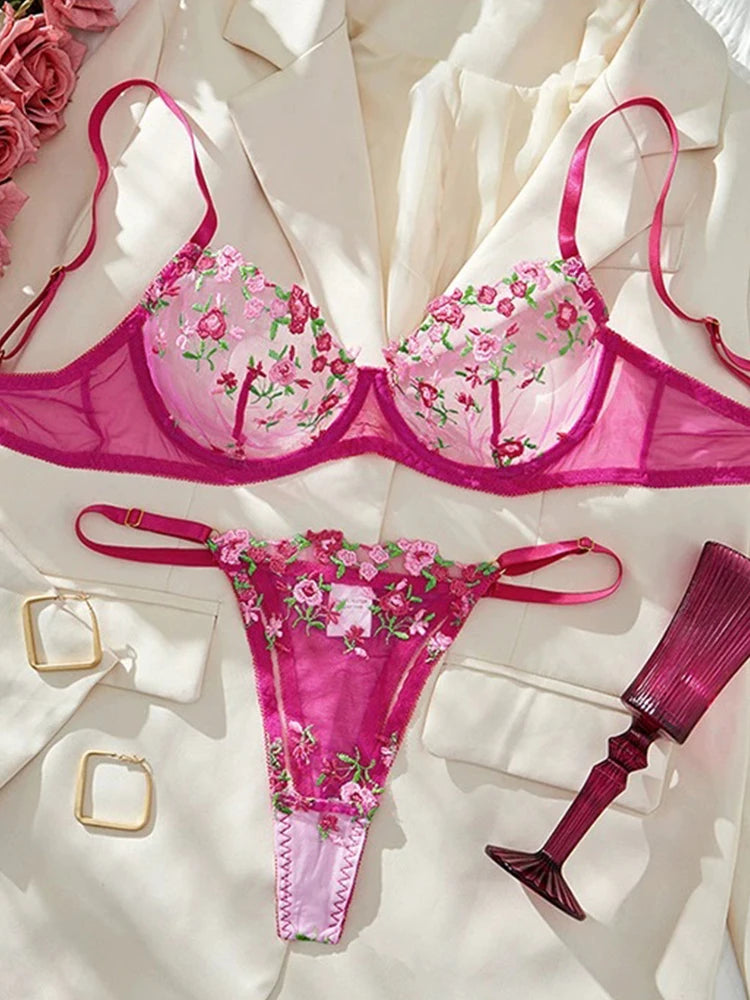 Pink floral lingerie set on a white background