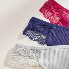 Three pairs of lace-trimmed underwear in pink, blue, and white on a light background.