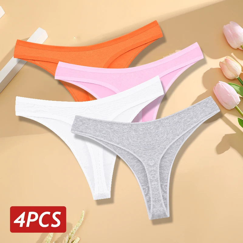 Four pairs of women's underwear in orange, pink, white, and gray on a beige background with tulips.