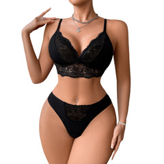 Black lace lingerie set on a model against a white background