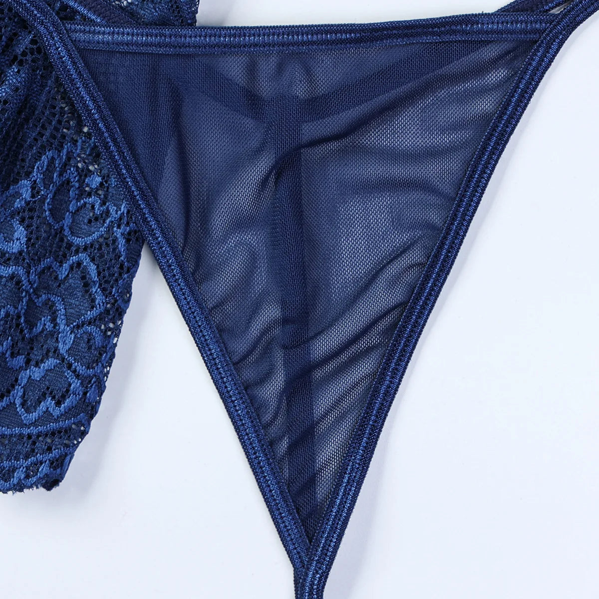Navy blue lace lingerie on a white background