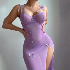 Purple dress with butterfly details on a plain background