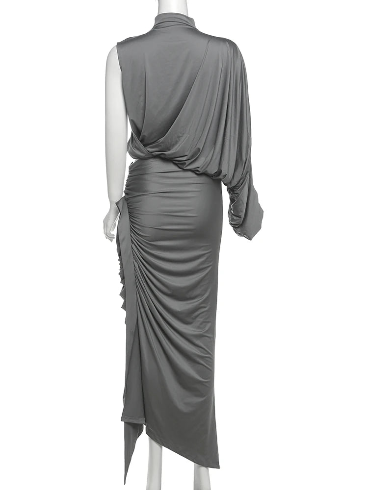 Gray draped dress on a mannequin against a white background