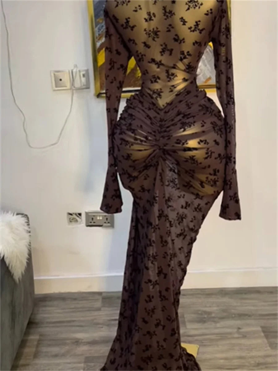 Sheer brown dress with floral pattern in a room setting