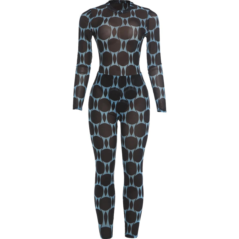 A long-sleeve, high-neck full-body jumpsuit with a black and light blue geometric pattern, displayed on a clean white background.