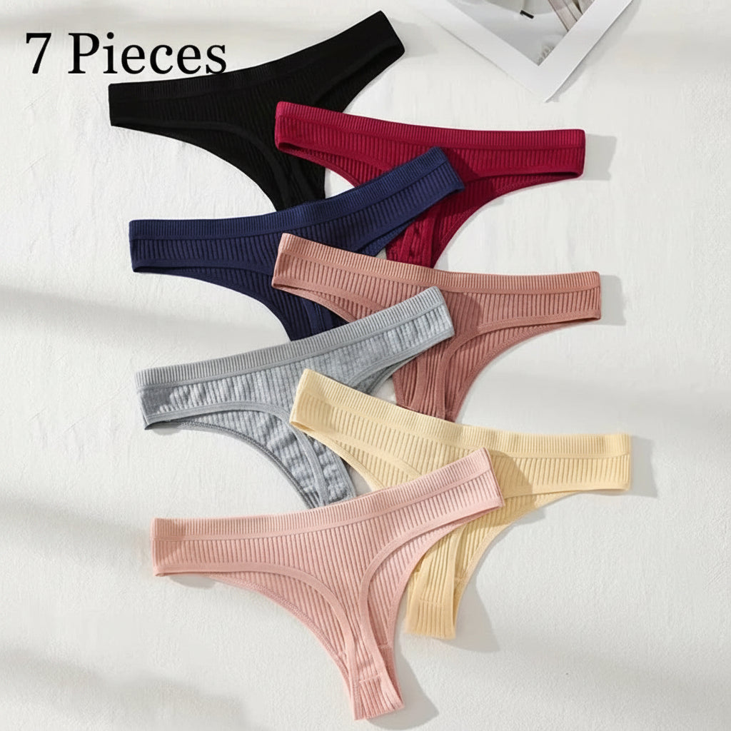 Set of colorful ribbed thongs on a white background