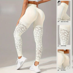 White leggings with mesh panels worn by a person on a gray background