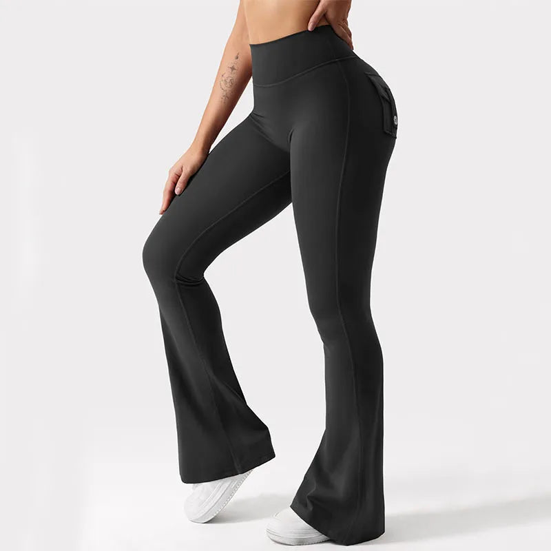 Black flared pants worn by a person on a white background