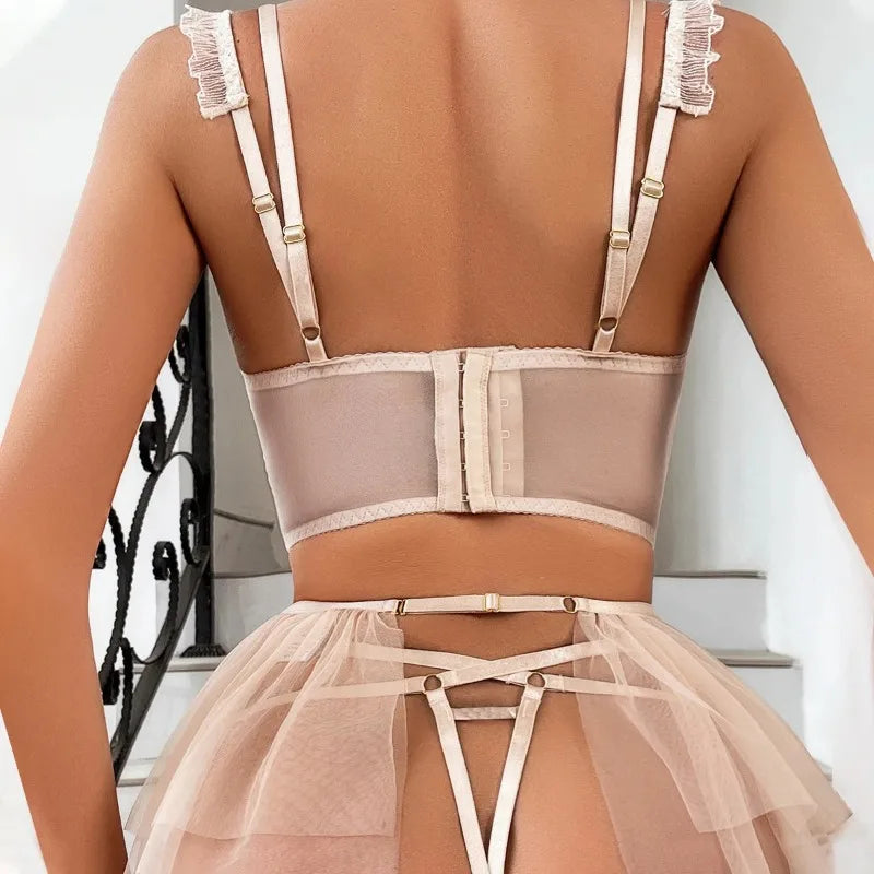 Beige lingerie set with straps on a neutral background