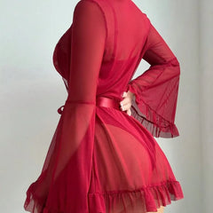 Red dress with sheer sleeves and ruffled hem on a plain background