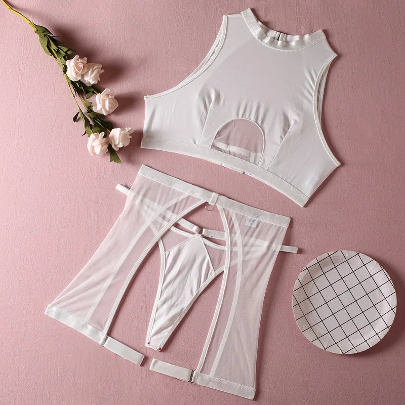 White lingerie set with mesh details on a pink background
