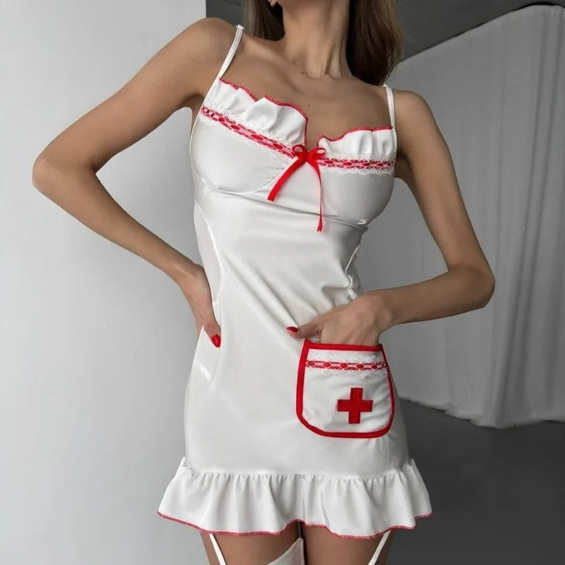 White dress with red accents and a cross pocket on a plain background